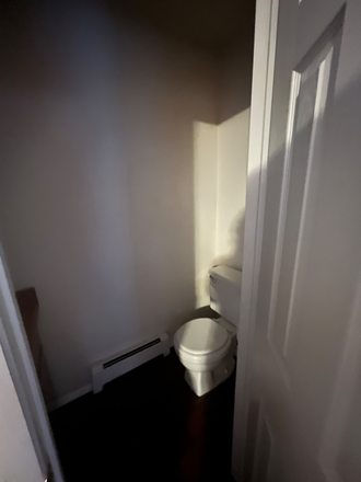 1/2 Bathroom by front door - 1850 Goss St Apartments