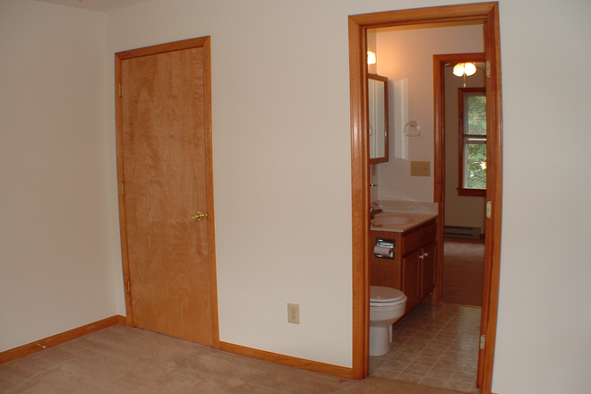 Bedroom plus bathroom - Tamaracks Apartments