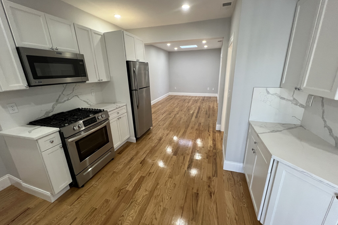 visit hubrealtyproperties.com - Beautiful 2 bedroom with laundry in unit and large deck, on side street near Porter Square Apartments