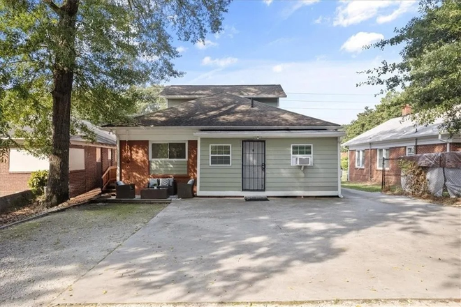Backyard Parking area - Rooms available in Student home. Private or shared bath. Utilities & wifi included.