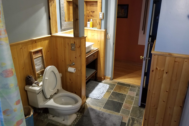 Tenant bathroom with step in tub/shower. - Room in private house available in vibrant Whiteaker neighborhood.