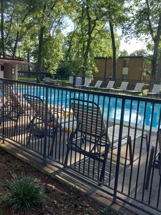 Pool area - Renovated Condo; Overlooking Pool; Interior/Park-like Setting; Upstairs Condo! Rarely available!