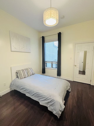 Bedroom of main floor room another angle - Modern Private Suite Walk to U of T Furnished Excellent Location! Duplex