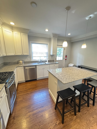 Updated kitchen with new appliances. Lots of space with island - FULLY FURNISHED 7 BED/ 3 BATH!! PRIME LOCATION. UPDATED HOUSE + PRIVATE DECK