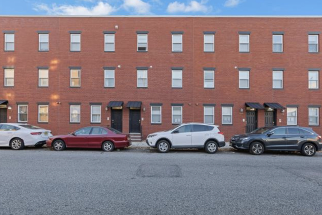 Front building - Modern three bedroom apartment with a gym and onsite parking!