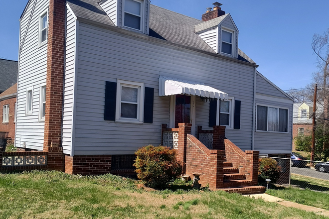 Exterior Front Entrance (from yard) - HOUSE-Charming 3 Br 2 Bath Cape Cod close to UMD Shuttle and Metro stops!