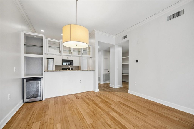 Open-concept living room + kitchen - The Vistas in midtown Condo
