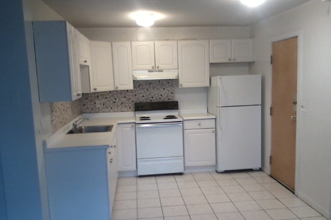 visit hubrealtyproperties.com - Mission Hill, studio with modern kitchen and bathroom on green line T Apartments