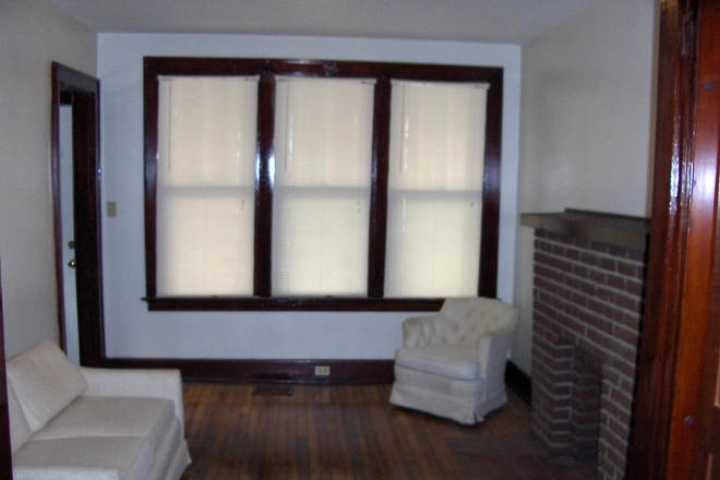 Living Room with decorative Fireplace, hardwood floors. - Great for Grad Student, Clean , BR, furnished or unfurnished, Walk to UC,  22  or older. 8/1/25