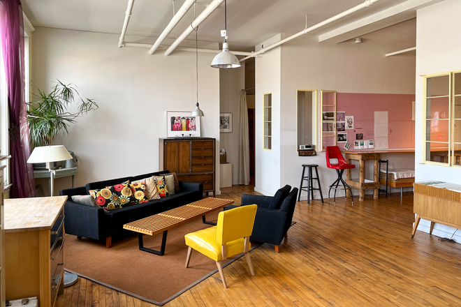 Living room with high quality mid-century modern furniture, 11' ceilings. Great place to relax. - Furnished South End loft apt. Jan 1, 2026. Live alone: I only work here daytime M-F. Walk to BUMC