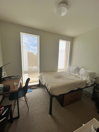 Furnished bedroom with full size bed and desk. Large closet - Olympia Place Apartment avail starting January 2025