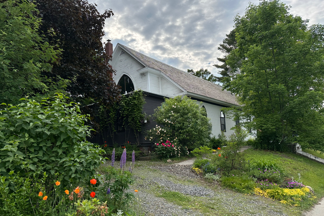 exterior view from driveway, entrance at top of driveway (brown section) - Church Home
