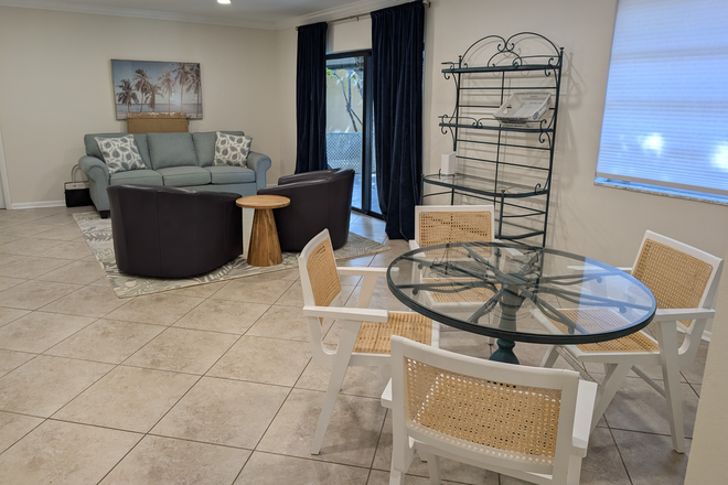 Living Room & Dining Area - Spacious, Furnished 3/2 Updated Duplex House - Steps from Campus