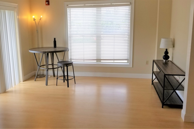living room - Attn: 2 mi to UVMMC. Take the Bike path directly to Campus. Free Heat/garage prkg & storage