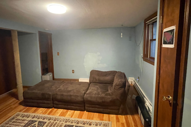 Living Room - Room with private bath and living room (shared kitchen).  Two miles from town. Convenient to bus House