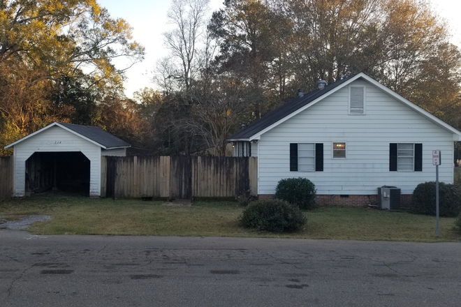 Side Street View - Charming house on corner lot located on Avenues with Private Yard, Patio. Close to Campus, Shopping