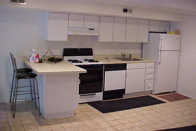 Adjoining kitchen to front room - Garden apartment in Tri-Taylor Historic District, Near West Side, in the Illinois Medical District