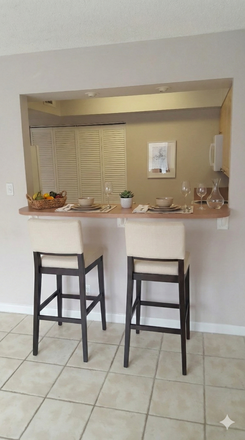 Bar Counter-Some photos have been virtually staged to illustrate furnishing possibilities. The apartment is currently offered unfurnished. - 1/1 walk to Nova campus * villa style* Condo