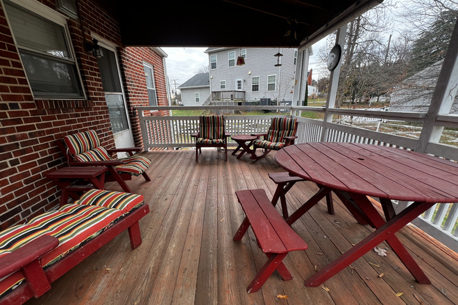 Back deck - covered with ceiling fan - Location !  0.4 miles from UMD.  On UMD Shuttle bus route. No need for a car. Fully furnished. House
