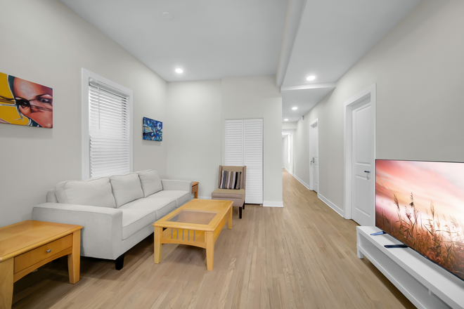 Living Room - Fully Renovated & Furnished - 4 Bed /2 Bath Beautiful Modern Apartment