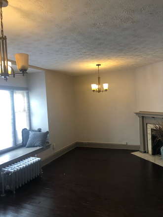 Light filled living & dining room.  Window seat! - LAMONT APARTMENTS/ CLOSE TO CWRU, DENTAL SCHOOL, CLEVELAND CLINIC!