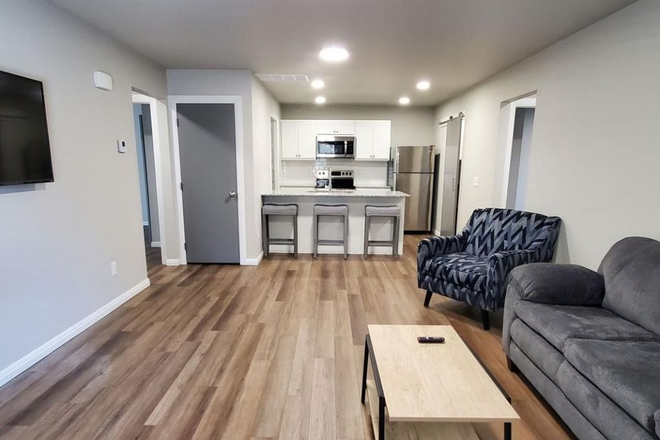 Living Room - Student housing walking distance to campus! Duplex