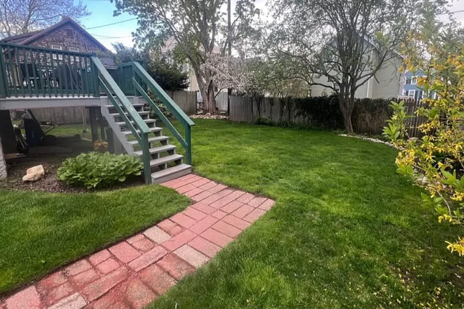 Fenced in yard with shared back deck and farmer's porch - 3 Bedroom Apartment in Historic Acushnet Heights Neighborhood - Heat included!
