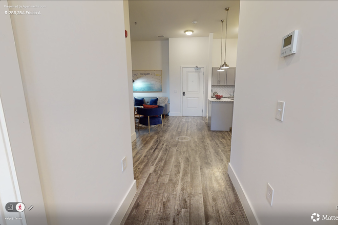 Hallway into living room/kitchen - Aspen Heights Apartments