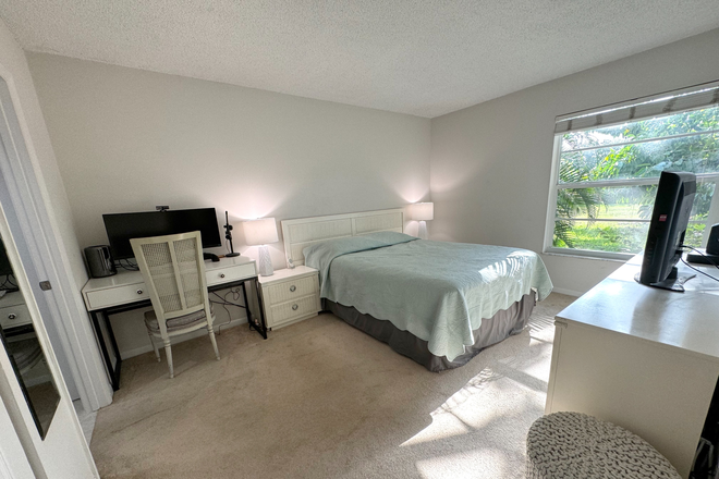 Bed 1 - 5-Min Walk to FAU – Private Room in Furnished 2/2 Condo w/ Pool & Canal Views – $1,700