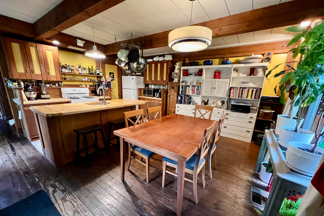 Fully equipped kitchen with plenty of seating - Bright Huge Furnished Queen Bedroom - Writer’s Dream - Available Jan 1, 2026 for Spring Condo