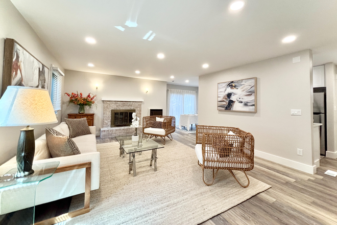 living room (staged photo, does not come furnished) - Brand New Remodeled 2 bedroom/2 Bathroom - 4885 Eisenhower Drive Apartments
