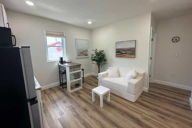 Living room - Newly Renovated Furnished 2BR Suite Near UMD – Utilities Included Apartments