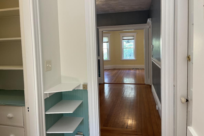living room seen from kitchen pantry - Large, Sunlit 2-Bedroom Apartment in Desirable Huron Village, Cambridge