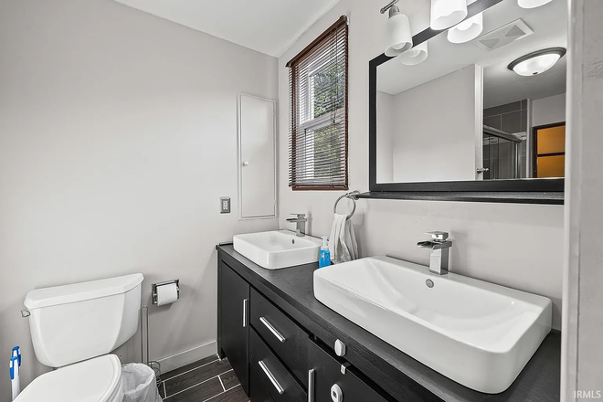 Bathroom 1 - Walk to Purdue (0.7 mi) - Large Furnished Bedroom  · House