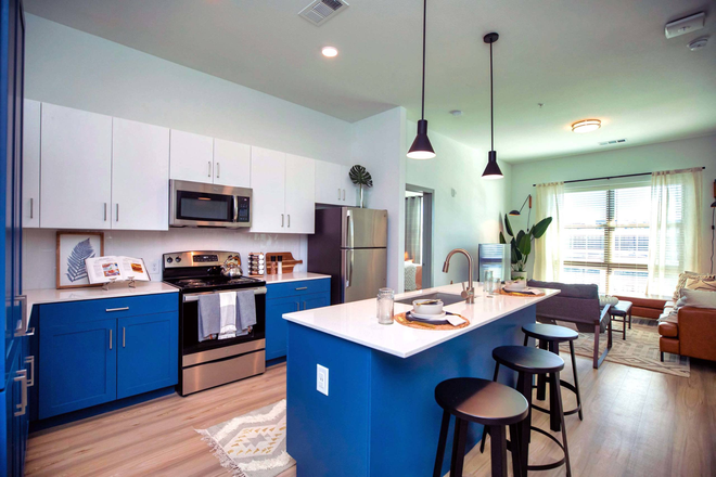 Photo of the kitchen from the website. Actual unit should look similar since it comes furnished. - Lumen Apartments