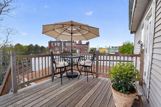 Rear Deck - Ultra-commutable 7 Mins to MGH via Blue Line! Modern Furnished 2B w/ In-Unit Laundry - All Inclusive Condo