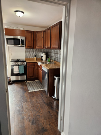 Kitchen view from 1st floor living area - Cute Little Furnished Cottage Within Walking Distance of Vandy