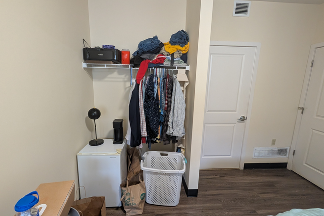 Bedroom (clothing rack view) - 8 1/2 Canal Apartments