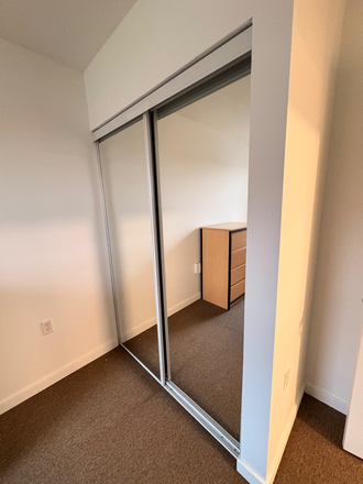Closet doors are mirrors! - South Campus Commons Apartments