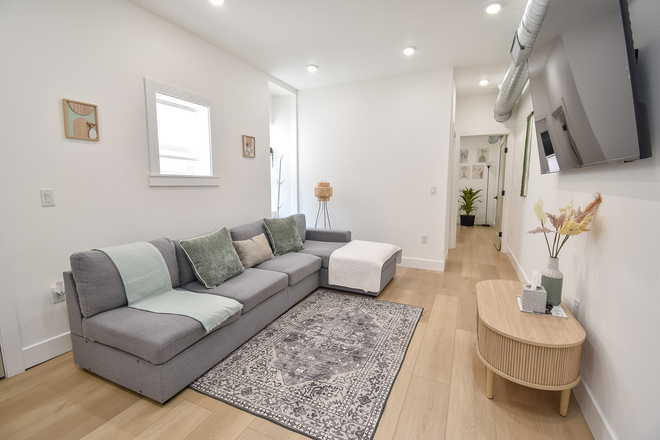 Living Room - The Boho Spruce Suite - Near Hospitals & Center City Duplex