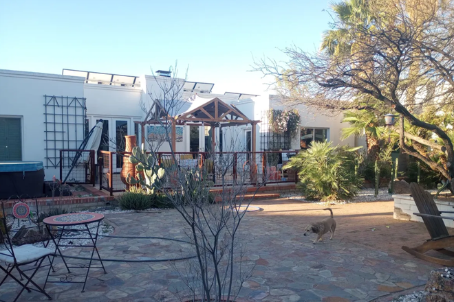Exterior. The yard has a large trampoline, play area for kids, koi pond, and shaded seating areas. - Gorgeous 4 bedroom / 4 bathroom family home - furnished