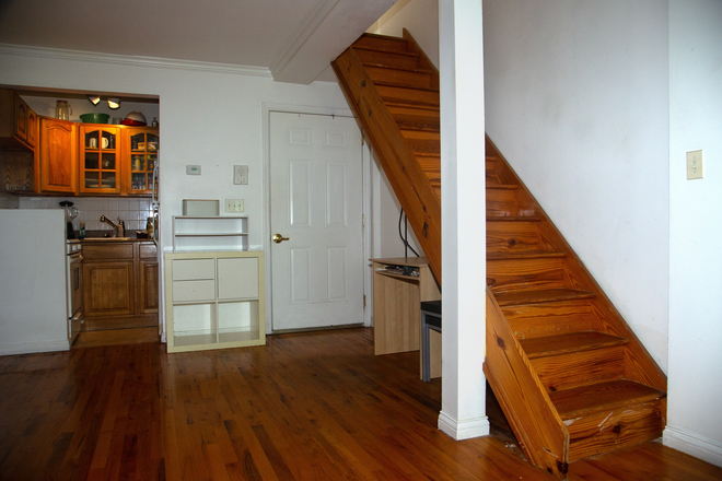 Apartment entry, living room, kitchen, and staircase to the second-floor balcony. - 1 Year-Harlem Sublease 2 bed/ 2 bath Apt: Sep 2026-Sep 2027