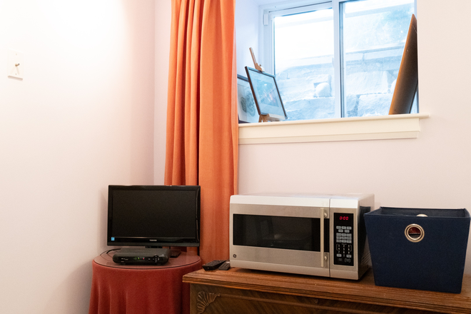 Window looking east - Lovely private, quiet furnished all-inclusive suite with private laundry in historic Seaton Village Apartments