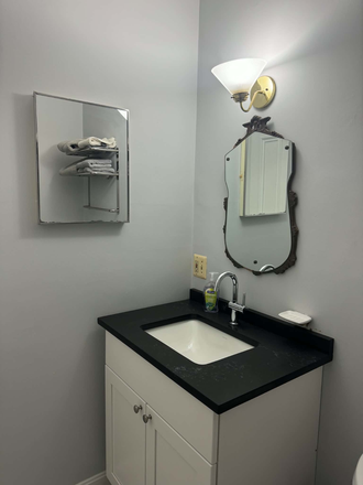 Vanity in full shower bathroom - Central Square studio just renovated, furnished: all utilities included Apartments