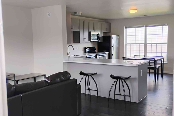 Living room/Kitchen area - RedPoint Apartments