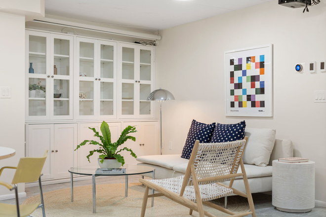 living room with projector - one bedroom apartment