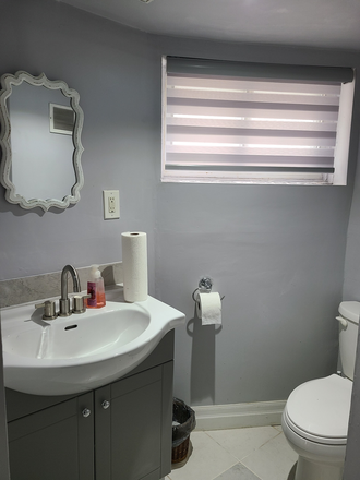 Clean bright bathroom - Leslieville Clean Renovated Basement Studio Apartments