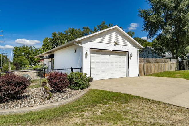 2 car garage with opener and parking space in front of door - 11-Miles  North of ND $3570 2 bedroom 2.5 garage fenced yard basement safe home