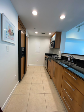 Kitchen with washer/dryer - FURNISHED STUDIO at "ONE MIAMI" ; WATER VIEWS-BEST DOWNTOWN LOCATION Apartments
