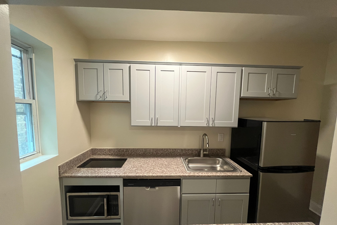 Renovated kitchen - Updated & Stylish: Renovated Studios for Comfortable Living Apartments